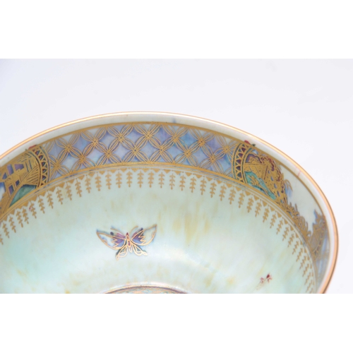 67 - AN EARLY 20th CENTURY WEDGEWOOD LUSTER BOWL decorated with butterflies on a mottled orange exterior ... 