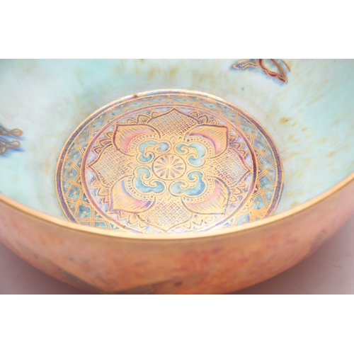 67 - AN EARLY 20th CENTURY WEDGEWOOD LUSTER BOWL decorated with butterflies on a mottled orange exterior ... 