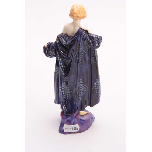 77 - AN ART DECO ROYAL DOULTON FIGURE 'THE BATHER' numbered HN.687 20cm high.