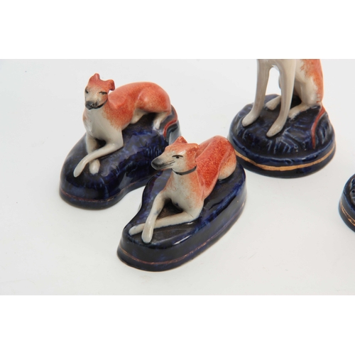 96 - TWO PAIRS OF LATE 19TH CENTURY STAFFORDSHIRE HOUNDS 9cm wide 6.5cm high and 6cm wide 11cm high.