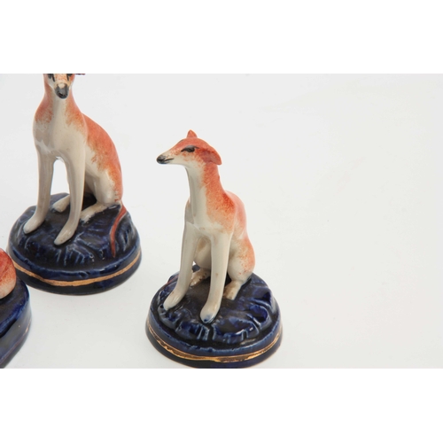 96 - TWO PAIRS OF LATE 19TH CENTURY STAFFORDSHIRE HOUNDS 9cm wide 6.5cm high and 6cm wide 11cm high.