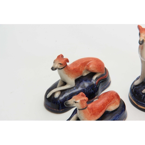 96 - TWO PAIRS OF LATE 19TH CENTURY STAFFORDSHIRE HOUNDS 9cm wide 6.5cm high and 6cm wide 11cm high.