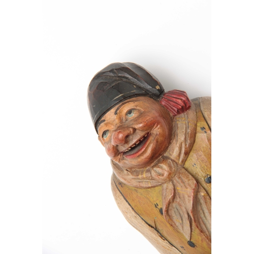 356 - A BLACK FOREST POLYCHROME CARVED WOOD COAT HOOK depicting a humorous figure 19cm high