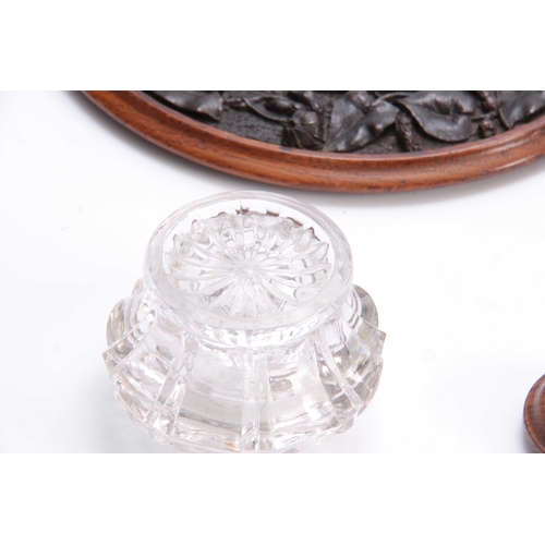 361 - A 19TH CENTURY CARVED OAK CIRCULAR INK STAND with cut glass inkwell to the centre having a floral ca... 