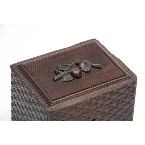 362 - A 19TH CENTURY BLACK FOREST HATCHED CARVED WOOD TEA CADDY with carved fruit to the ribbed top 14cm b... 