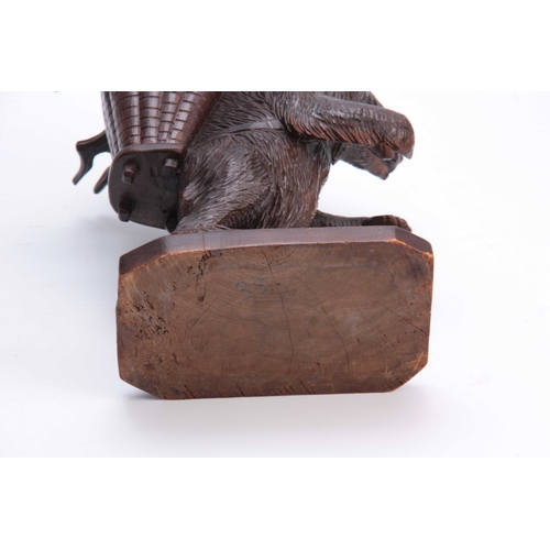 365 - A LATE 19TH CENTURY SWISS CARVED BLACK FOREST BEAR DECANTER SET modelled as a bear carrying a basket... 