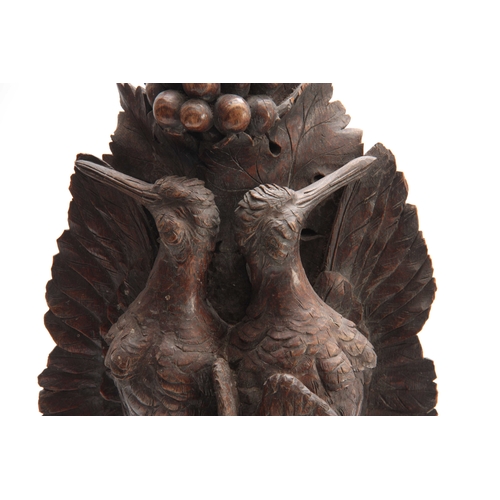 371 - A LARGE PAIR OF CARVED OAK BLACK FOREST WALL BRACKETS one having a lifesize brace of partridge among... 