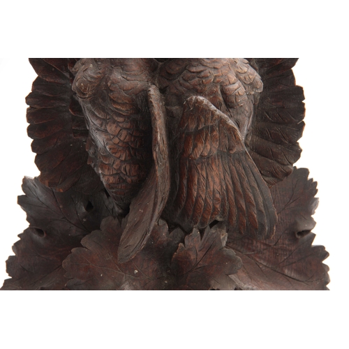 371 - A LARGE PAIR OF CARVED OAK BLACK FOREST WALL BRACKETS one having a lifesize brace of partridge among... 