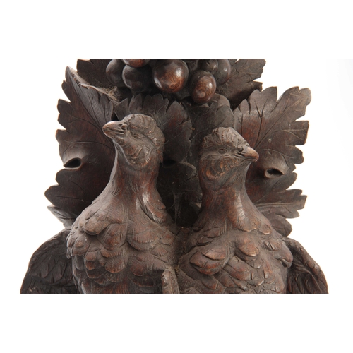 371 - A LARGE PAIR OF CARVED OAK BLACK FOREST WALL BRACKETS one having a lifesize brace of partridge among... 