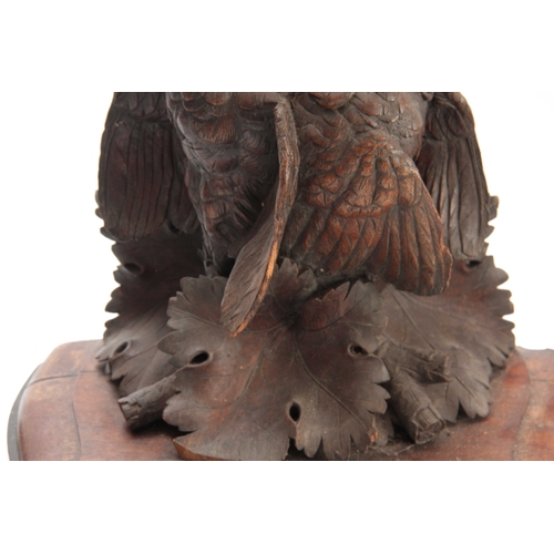 371 - A LARGE PAIR OF CARVED OAK BLACK FOREST WALL BRACKETS one having a lifesize brace of partridge among... 