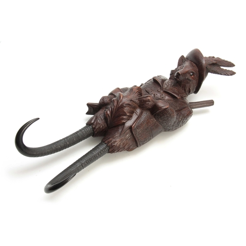 380 - A LARGE LATE 19th CENTURY MUSICAL CARVED BLACK FOREST COAT HOOK modelled as a well-dressed fox with ... 