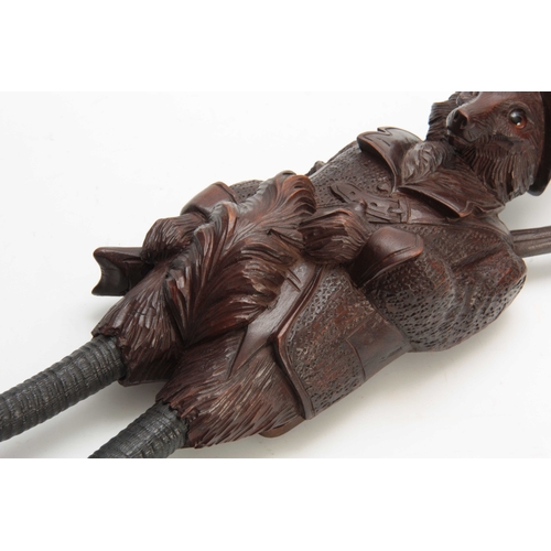 380 - A LARGE LATE 19th CENTURY MUSICAL CARVED BLACK FOREST COAT HOOK modelled as a well-dressed fox with ... 