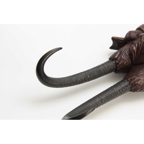 380 - A LARGE LATE 19th CENTURY MUSICAL CARVED BLACK FOREST COAT HOOK modelled as a well-dressed fox with ... 