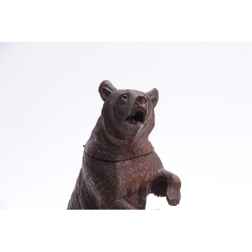 382 - A LATE 19TH CENTURY SWISS CARVED BEAR MUSICAL CIGAR BOX with hinged compartment and brass match hold... 