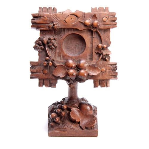 383 - A 19TH CENTURY SWISS CARVED BLACK FOREST POCKET WATCH HOLDER decorated with a cross-hatched frame wi... 