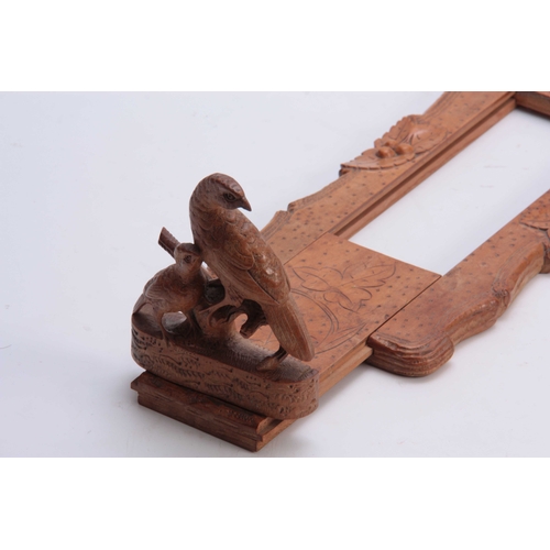 385 - A LATE 19TH CENTURY SWISS BLACK FOREST CARVED ADJUSTABLE BOOKREST with partridge to each side on nat... 