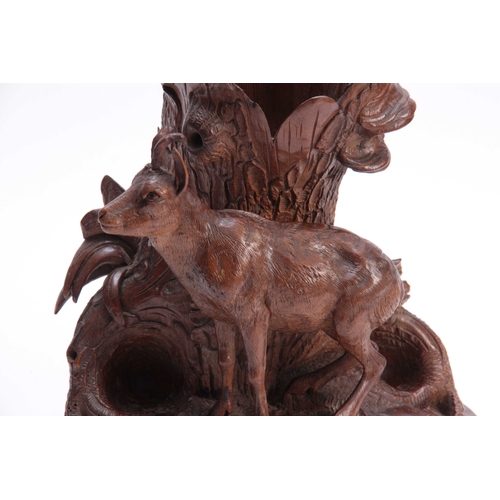 386 - A LATE 19TH CENTURY SWISS BLACK FOREST CARVED LINDENWOOD ONE PIECE VASE depicting a mountain goat ne... 