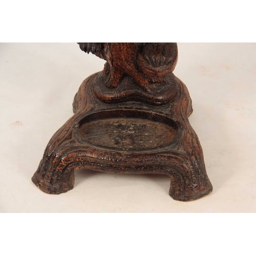 393 - A LATE 19TH CENTURY SWISS CARVED BLACK FOREST BEAR STICK STAND with a large bear with glass eyes hol... 