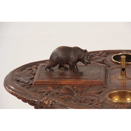 394 - A LATE 19TH CENTURY SWISS CARVED BLACK FOREST SMOKERS TABLE with leaf carved top having two bear lid... 