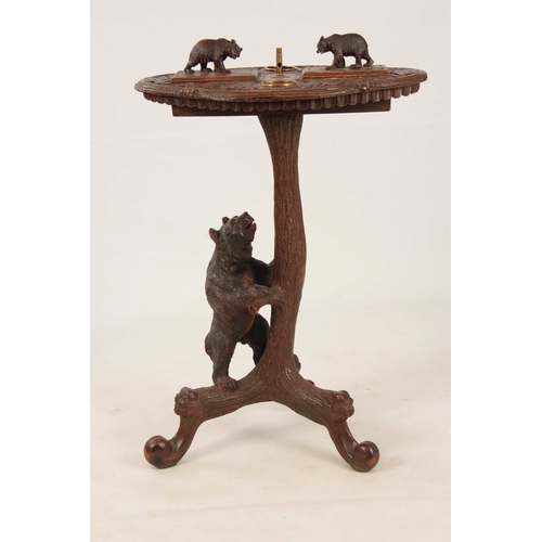 394 - A LATE 19TH CENTURY SWISS CARVED BLACK FOREST SMOKERS TABLE with leaf carved top having two bear lid... 