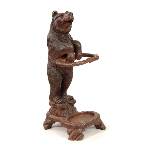 396 - A LATE 19TH CENTURY SWISS CARVED BLACK FOREST BEAR STICK STAND with a large bear having glass eyes h... 