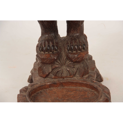 396 - A LATE 19TH CENTURY SWISS CARVED BLACK FOREST BEAR STICK STAND with a large bear having glass eyes h... 