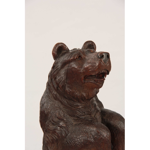 396 - A LATE 19TH CENTURY SWISS CARVED BLACK FOREST BEAR STICK STAND with a large bear having glass eyes h... 