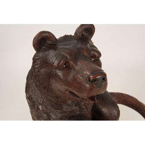 396 - A LATE 19TH CENTURY SWISS CARVED BLACK FOREST BEAR STICK STAND with a large bear having glass eyes h... 