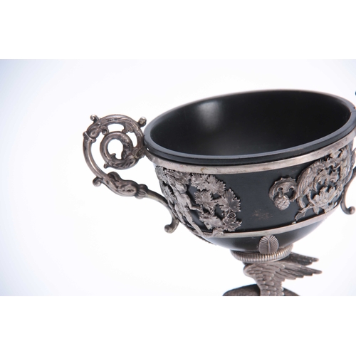 402 - A 19TH CENTURY SILVER METAL CHALICE with parrot cast base and flared foot 20cm