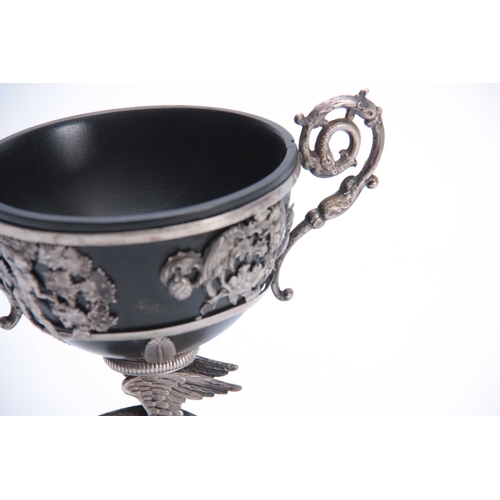 402 - A 19TH CENTURY SILVER METAL CHALICE with parrot cast base and flared foot 20cm