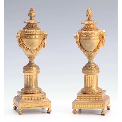 407 - A PAIR OF 19TH CENTURY FRENCH ORMOLU CLASSICAL URN SHAPED CANDLESTICKS the reversible sconces with r... 