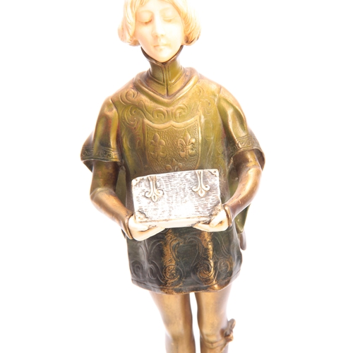 413 - LEON NOEL DELAGRANGE (1872-1910) AN ART DECO BRONZE AND IVORY FIGURE ON A YOUNG SERVANT BOY having g... 