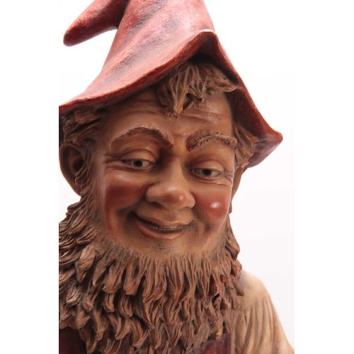 415 - A LARGE EARLY 20TH CENTURY EASTERN EUROPEAN POLYCHROME PAINTED TERRACOTTA STANDING GNOME holding a t... 