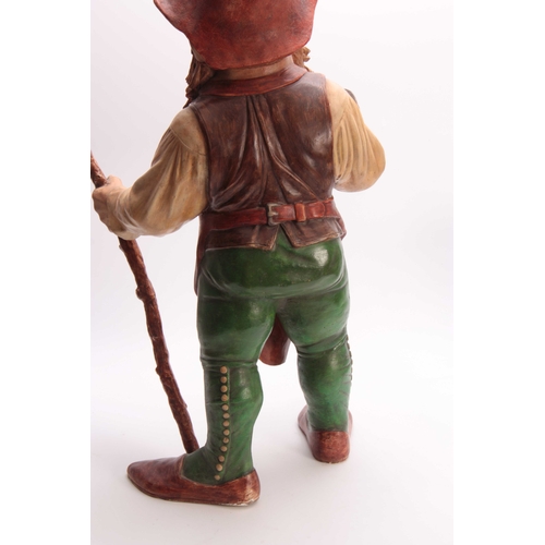 415 - A LARGE EARLY 20TH CENTURY EASTERN EUROPEAN POLYCHROME PAINTED TERRACOTTA STANDING GNOME holding a t... 