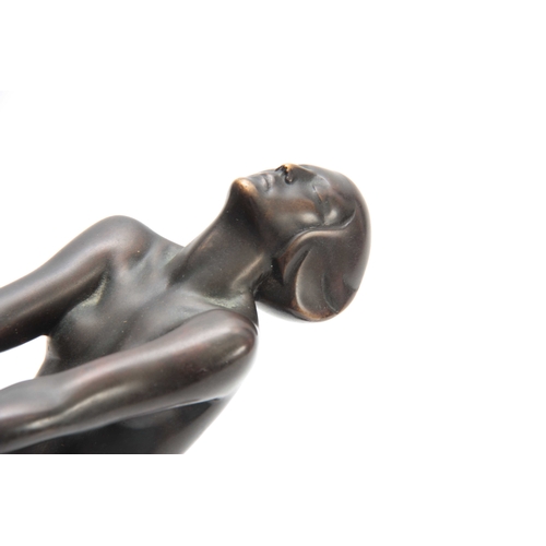 421 - LE VERRIER. A FRENCH ART DECO PATINATED BRONZE SCULPTURE modelled as a nude dancer mounted on a circ... 