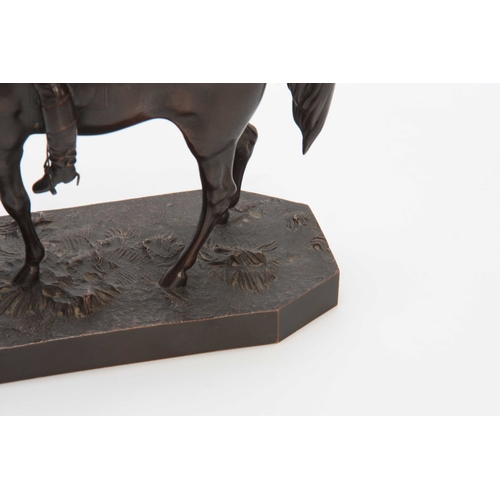 426 - A LATE 19th CENTURY PATINATED BRONZE SCULPTURE modelled as a jockey and horse on naturalistic base 2... 