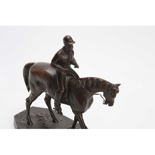 426 - A LATE 19th CENTURY PATINATED BRONZE SCULPTURE modelled as a jockey and horse on naturalistic base 2... 