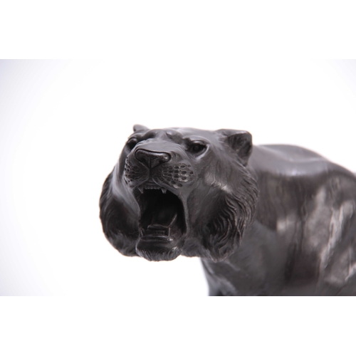 432 - A MEIJI PERIOD JAPANESE BRONZE TIGER - signed to the underside with character marks 56cm overall.