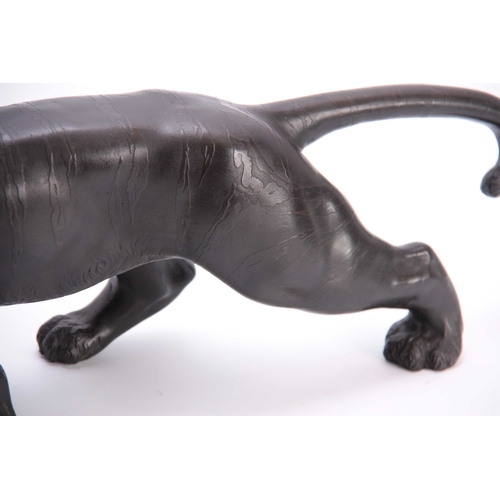 432 - A MEIJI PERIOD JAPANESE BRONZE TIGER - signed to the underside with character marks 56cm overall.