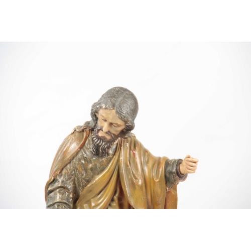 435 - A 19TH CENTURY CARVED WOOD POLYCHROME FIGURE OF SAINT ANTHONY on a rectangular plinth base 92cm high