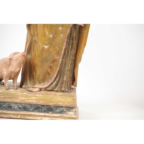 435 - A 19TH CENTURY CARVED WOOD POLYCHROME FIGURE OF SAINT ANTHONY on a rectangular plinth base 92cm high