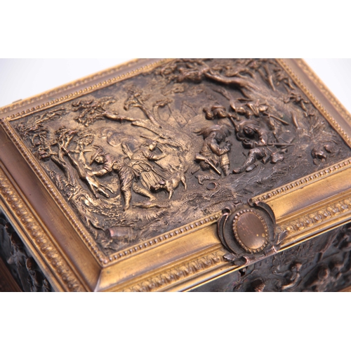 437 - A LATE 19TH CENTURY CONTINENTAL GILT BRASS JEWELLERY CASKET set with cast bronzed figural panels to ... 