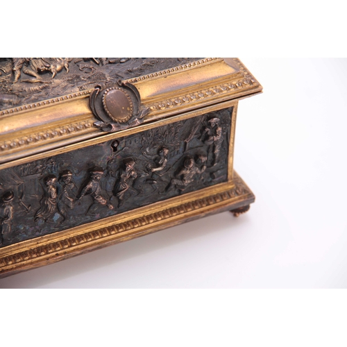 437 - A LATE 19TH CENTURY CONTINENTAL GILT BRASS JEWELLERY CASKET set with cast bronzed figural panels to ... 