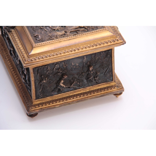 437 - A LATE 19TH CENTURY CONTINENTAL GILT BRASS JEWELLERY CASKET set with cast bronzed figural panels to ... 