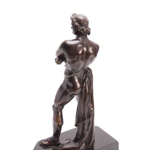 438 - A LATE 19th CENTURY PATINATED BRONZE FIGURE modelled as a semi-nude gladiator mounted on a black mar... 