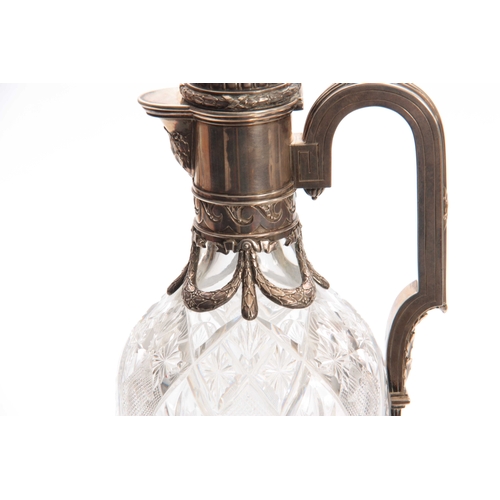 440 - A FABERGE TALL CUT GLASS CLARET JUG the oval elongated body with star-cut panels on a circular foot ... 