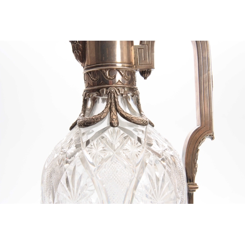 440 - A FABERGE TALL CUT GLASS CLARET JUG the oval elongated body with star-cut panels on a circular foot ... 