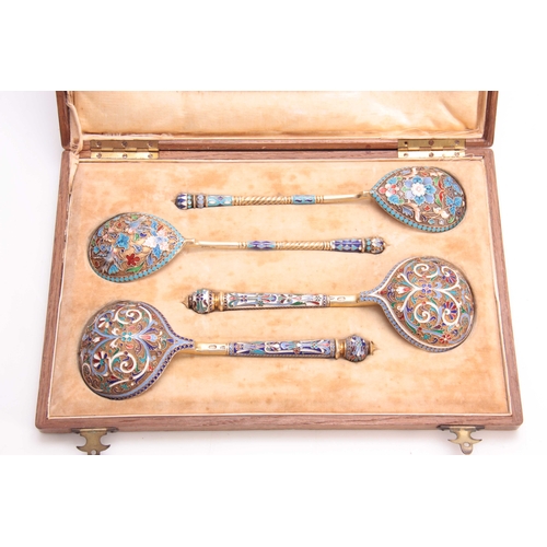 447 - A CASED COLLECTION OF FOUR RUSSIAN SILVER ENAMEL SPOONS colourfully decorated with flowers, birds an... 