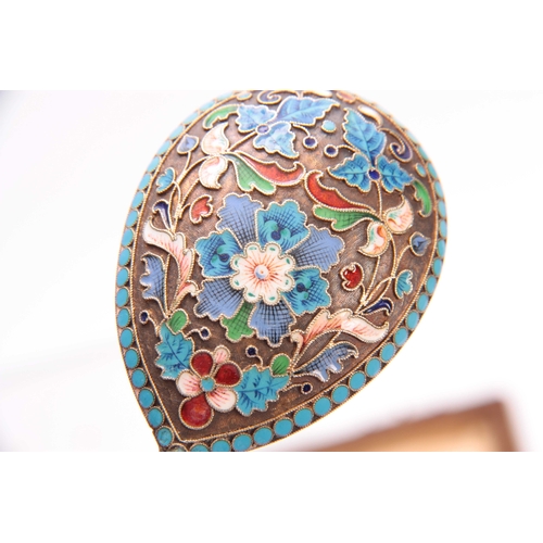 447 - A CASED COLLECTION OF FOUR RUSSIAN SILVER ENAMEL SPOONS colourfully decorated with flowers, birds an... 