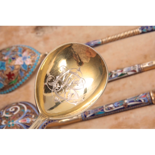 447 - A CASED COLLECTION OF FOUR RUSSIAN SILVER ENAMEL SPOONS colourfully decorated with flowers, birds an... 